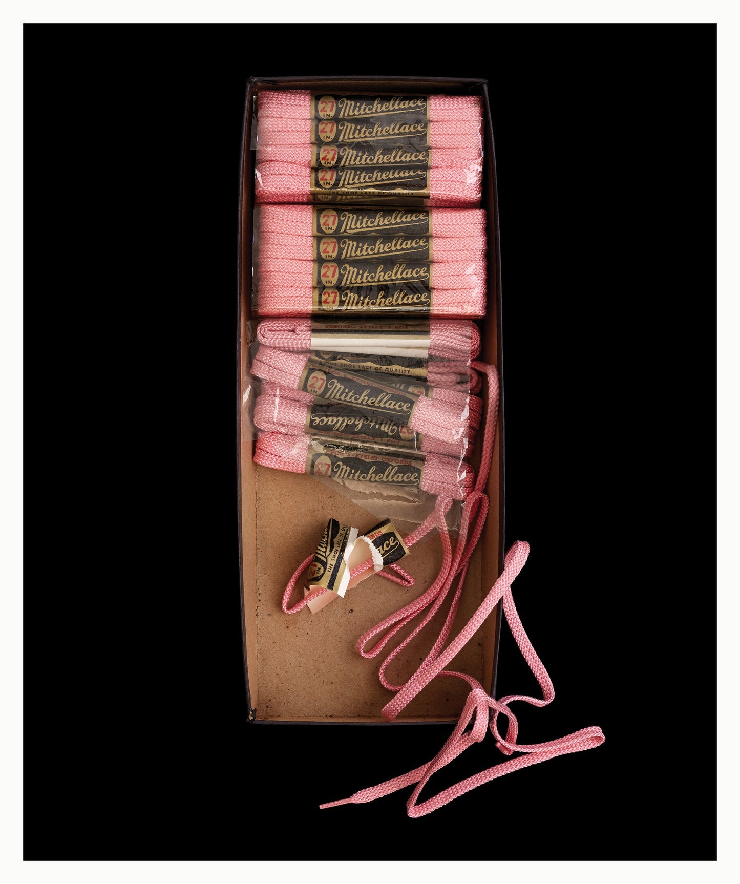 Box of pink shoelaces unframed