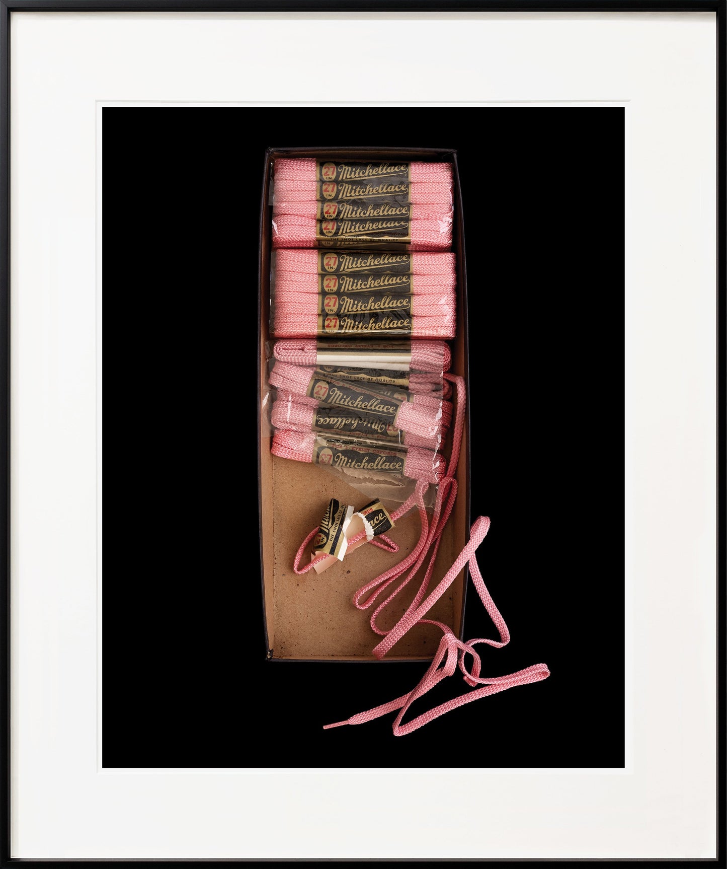 Box of pink shoelaces black metal frame