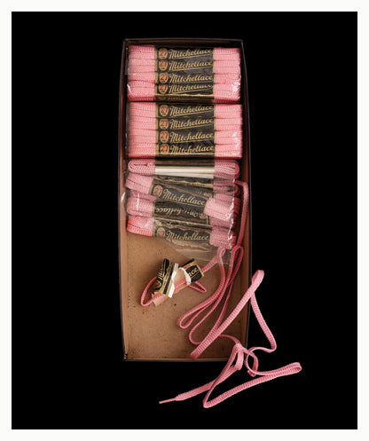 Box of pink shoelaces unframed