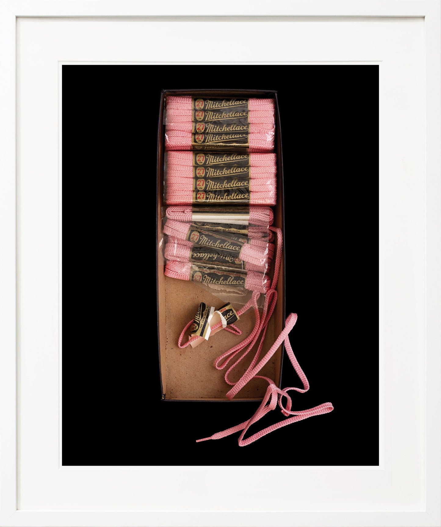 Box of pink shoelaces white frame